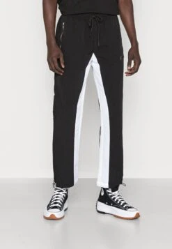 Pegador DEMERE WIDE TRACK PANTS UNISEX - Jogginghose - Black/white -Friboo Verkauf Geschaft 4eca3e509d724ae2a5e073e1715eeac2 1