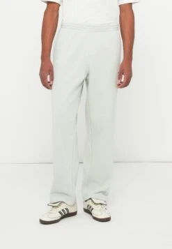 Adidas Originals UNISEX - Tracksuit Bottoms - Light Green